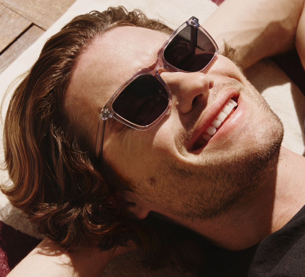 Person wearing clear-frame sunglasses